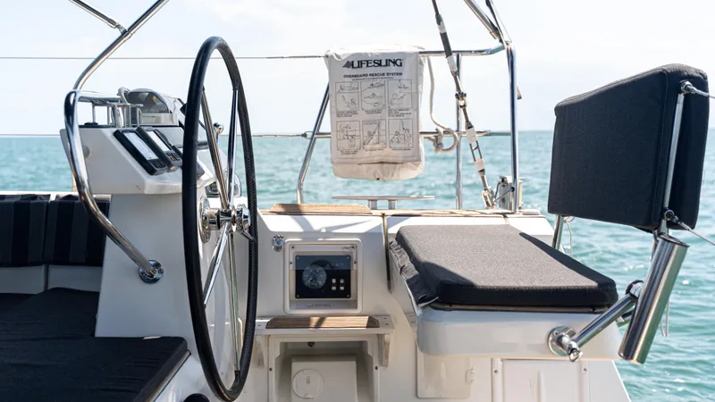 Indigo Dream Yacht Photos Pics Cockpit of 2012 Beneteau Sense 50 yacht with steering wheel and ocean view.