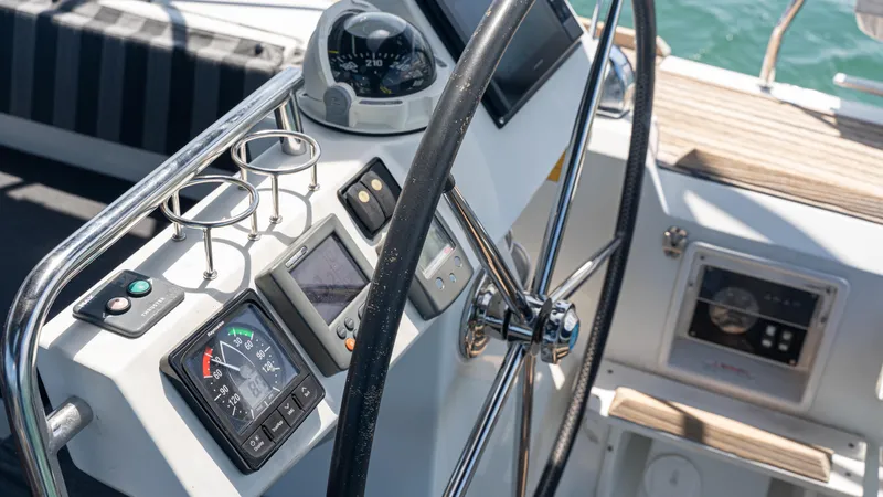 Indigo Dream Yacht Photos Pics Cockpit of 2012 Beneteau Sense 50 yacht with navigation instruments and steering wheel.