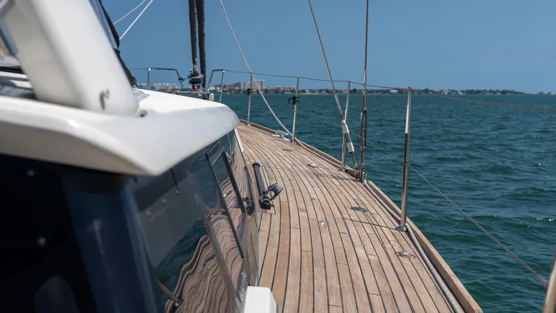 Indigo Dream Yacht Photos Pics 2012 Beneteau Sense 50 yacht deck on open sea, clear blue sky.