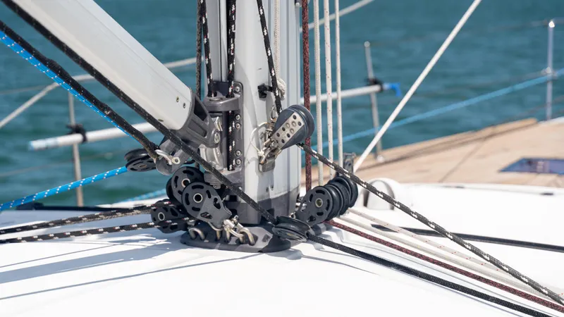 Indigo Dream Yacht Photos Pics Close-up of rigging on a 2012 Beneteau Sense 50 sailboat, showcasing pulleys and ropes.