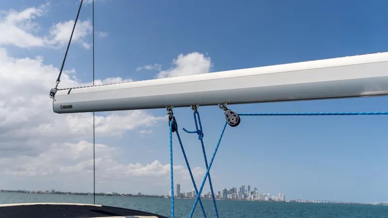 Indigo Dream Yacht Photos Pics Sailboat rigging on a 2012 Beneteau Sense 50 with city skyline in the background.