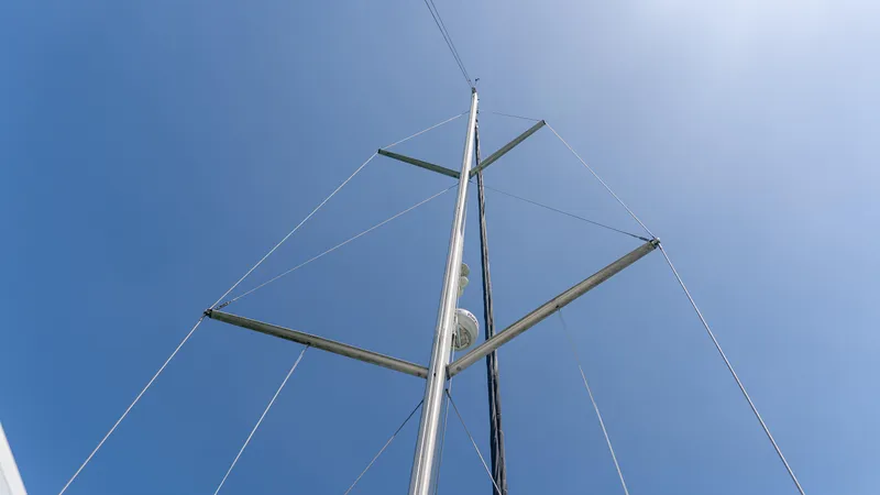 Indigo Dream Yacht Photos Pics Mast of 2012 Beneteau Sense 50 sailboat against clear blue sky.