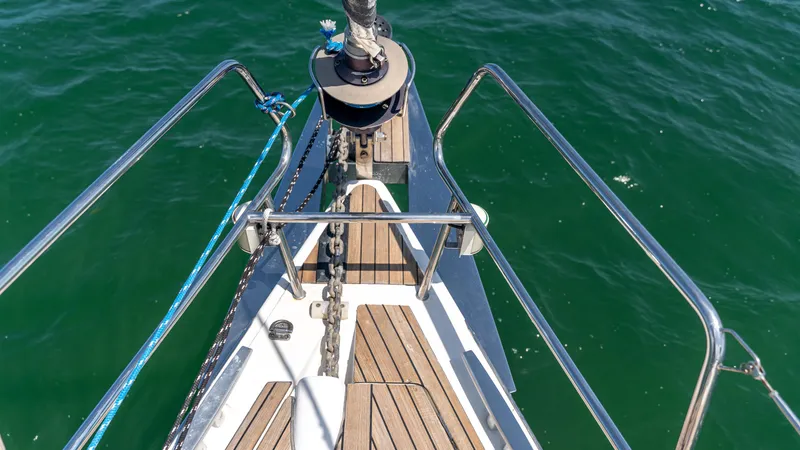 Indigo Dream Yacht Photos Pics Bow of 2012 Beneteau Sense 50 yacht with teak decking and stainless steel railings.