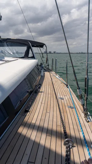 Indigo Dream Yacht Photos Pics 2012 Beneteau Sense 50 yacht deck with ocean view under cloudy sky.