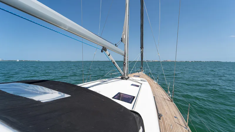Indigo Dream Yacht Photos Pics Sailing on a 2012 Beneteau Sense 50 yacht in open sea under clear blue skies.