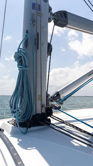 Indigo Dream Yacht Photos Pics 2012 Beneteau Sense 50 sailboat mast and rigging against a clear sky and ocean backdrop.