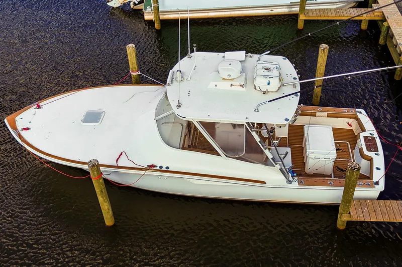  Yacht Photos Pics 2005 Egg Harbor 35' Express boat docked at marina, aerial view.