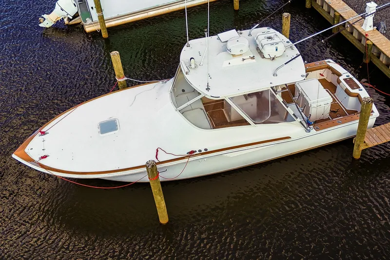  Yacht Photos Pics 2005 Egg Harbor 35' Express boat docked in marina, aerial view.