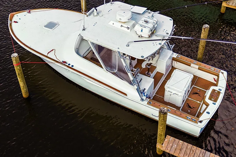  Yacht Photos Pics 2005 Egg Harbor 35' Express boat docked, aerial view, showcasing spacious deck and sleek design.
