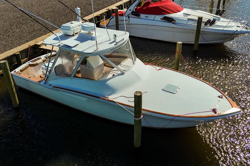  Yacht Photos Pics 2005 Egg Harbor 35' Express boat docked at marina, aerial view.