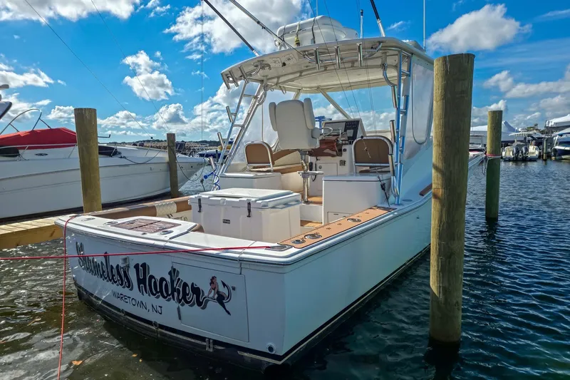  Yacht Photos Pics 2005 Egg Harbor 35' Express boat docked at marina under blue sky.