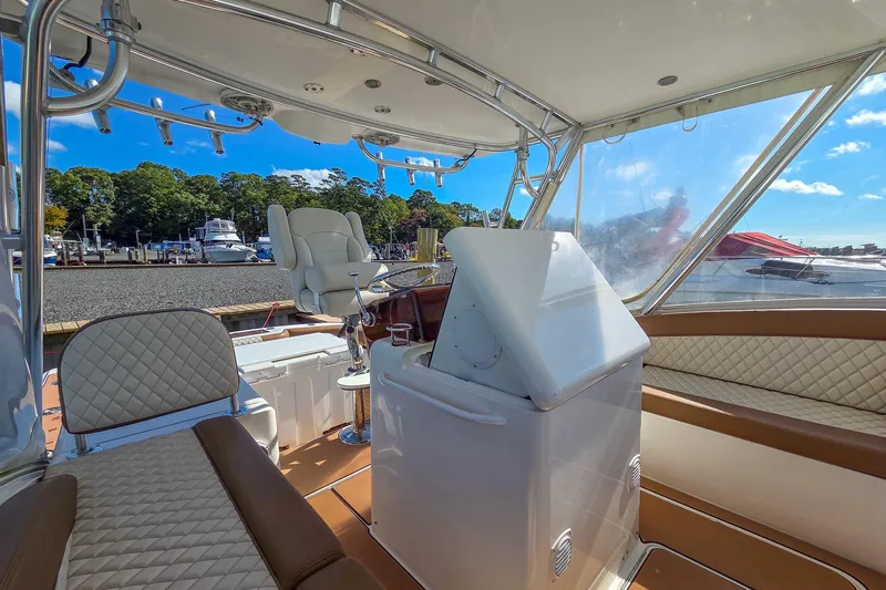  Yacht Photos Pics Interior of 2005 Egg Harbor 35' Express yacht with luxurious seating and helm station.