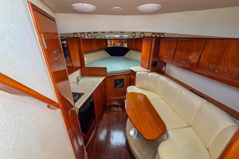 Yacht Photos Pics Interior of 2005 Egg Harbor 35' Express yacht with cozy seating and kitchenette.