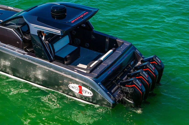  Yacht Photos Pics 2020 Cigarette 42' Auroris boat with powerful outboard engines on green water.