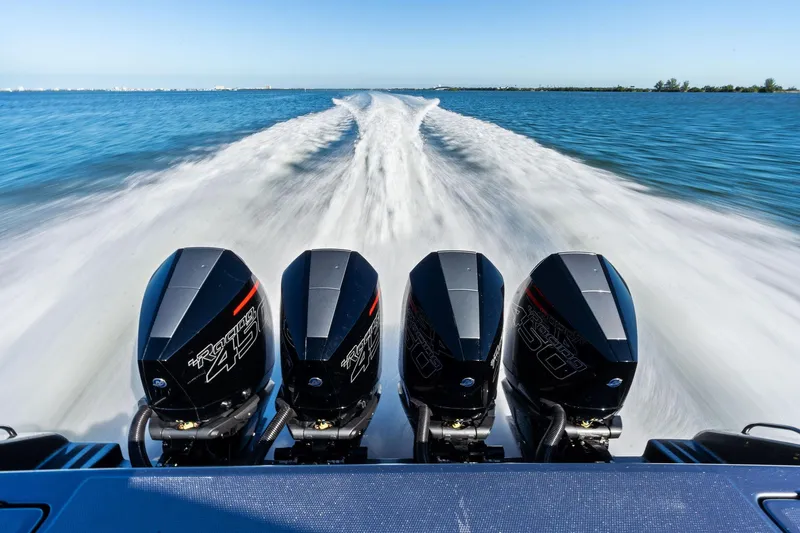  Yacht Photos Pics 2020 Cigarette 42' Auroris speedboat with four powerful outboard engines on open water.