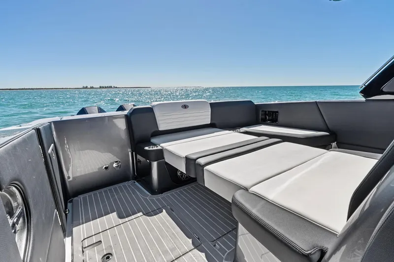  Yacht Photos Pics Luxurious 2020 Cigarette 42' Auroris boat interior with sleek seating and ocean view.