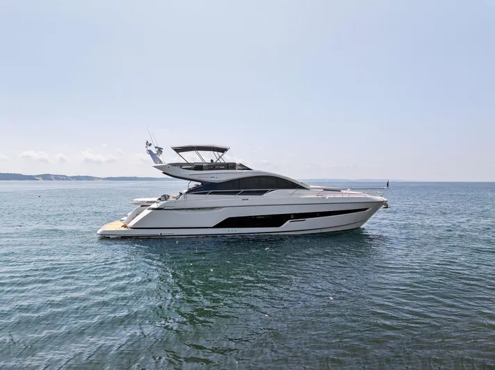  Yacht Photos Pics 2024 Fairline Phantom 65 yacht cruising on open water.