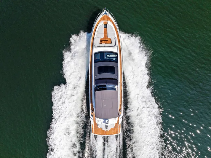  Yacht Photos Pics Aerial view of 2024 Fairline Phantom 65 yacht cruising on open water.