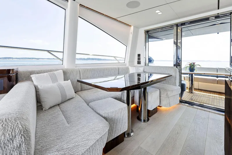  Yacht Photos Pics Luxurious interior of 2024 Fairline Phantom 65 yacht with elegant seating and ocean view.