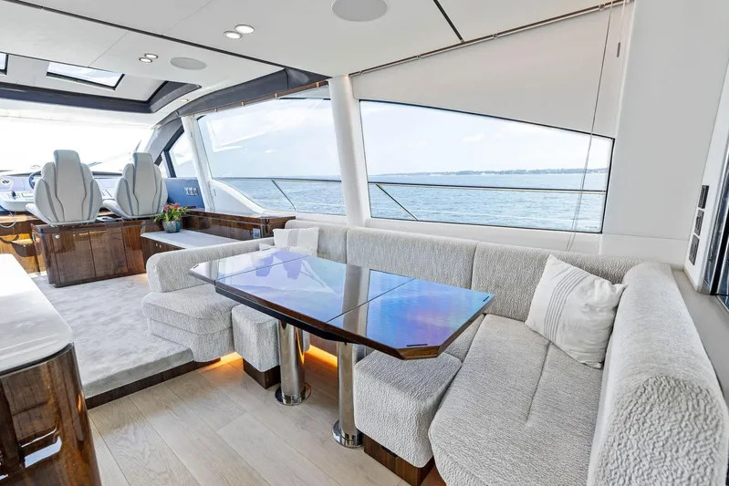  Yacht Photos Pics Luxurious interior of 2024 Fairline Phantom 65 yacht with elegant seating and ocean view.