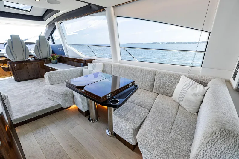  Yacht Photos Pics Luxurious interior of 2024 Fairline Phantom 65 yacht with ocean view.