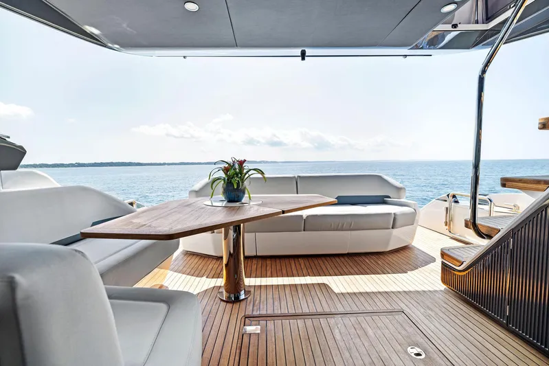  Yacht Photos Pics Luxurious 2024 Fairline Phantom 65 yacht interior with elegant seating and ocean view.