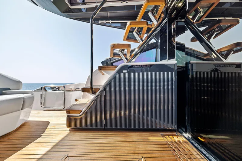  Yacht Photos Pics Luxury yacht Fairline Phantom 65, 2024 model, featuring elegant wooden deck and modern staircase design.