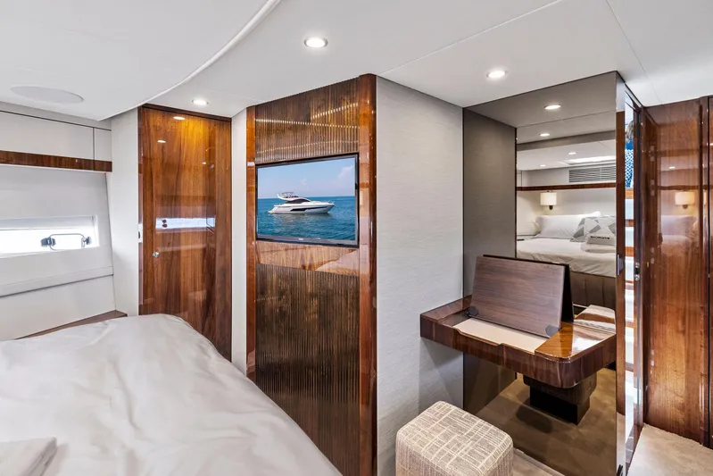  Yacht Photos Pics Luxurious interior of 2024 Fairline Phantom 65 yacht with elegant wood finishes and modern amenities.