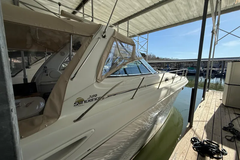 Fox Den Yacht Photos Pics 2001 Sea Ray 380 Sundancer docked in a marina under a covered structure.