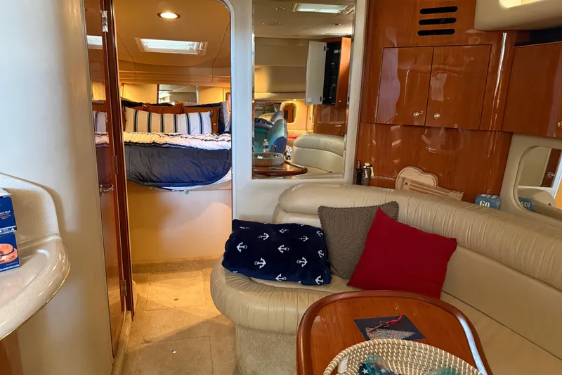 Fox Den Yacht Photos Pics Interior of 2001 Sea Ray 380 Sundancer yacht with cozy seating and elegant wood finishes.