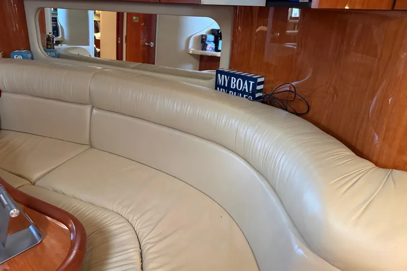 Fox Den Yacht Photos Pics Interior of 2001 Sea Ray 380 Sundancer with beige leather seating and wooden accents.