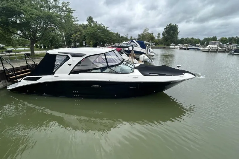  Yacht Photos Pics 2020 Sea Ray 350 SLX boat docked in a serene marina setting.
