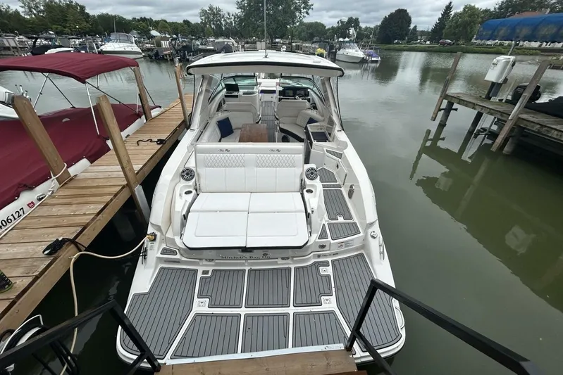  Yacht Photos Pics 2020 Sea Ray 350 SLX luxury boat docked at marina, featuring spacious seating and sleek design.