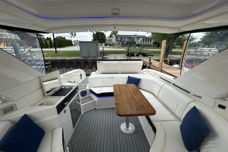  Yacht Photos Pics Luxurious interior of 2020 Sea Ray 350 SLX boat with seating and table.