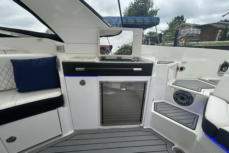  Yacht Photos Pics 2020 Sea Ray 350 SLX boat interior with seating, grill, and storage.