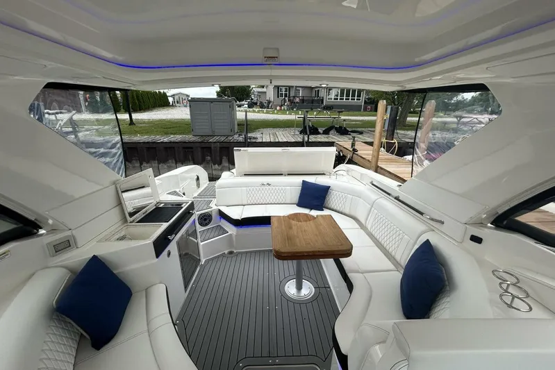  Yacht Photos Pics Luxurious interior of 2020 Sea Ray 350 SLX boat with seating and table.