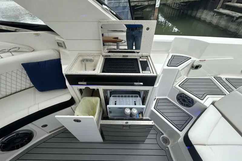  Yacht Photos Pics 2020 Sea Ray 350 SLX boat interior with kitchenette, seating, and storage.