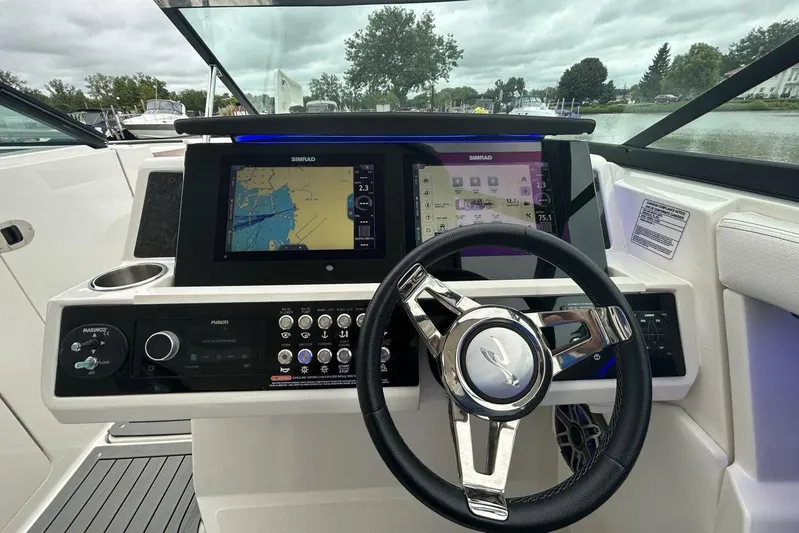  Yacht Photos Pics 2020 Sea Ray 350 SLX boat dashboard with navigation system and steering wheel.