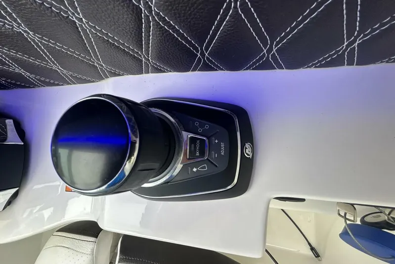  Yacht Photos Pics Control panel of a 2020 Sea Ray 350 SLX boat with leather stitching detail.