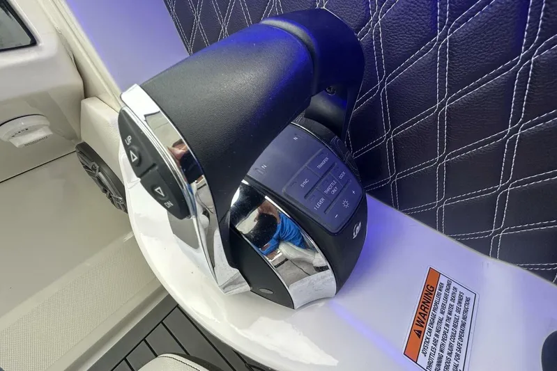  Yacht Photos Pics Close-up of 2020 Sea Ray 350 SLX boat throttle control with warning label.