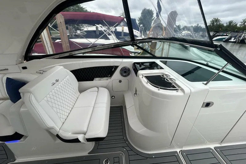  Yacht Photos Pics 2020 Sea Ray 350 SLX interior with white seating and sleek dashboard design.