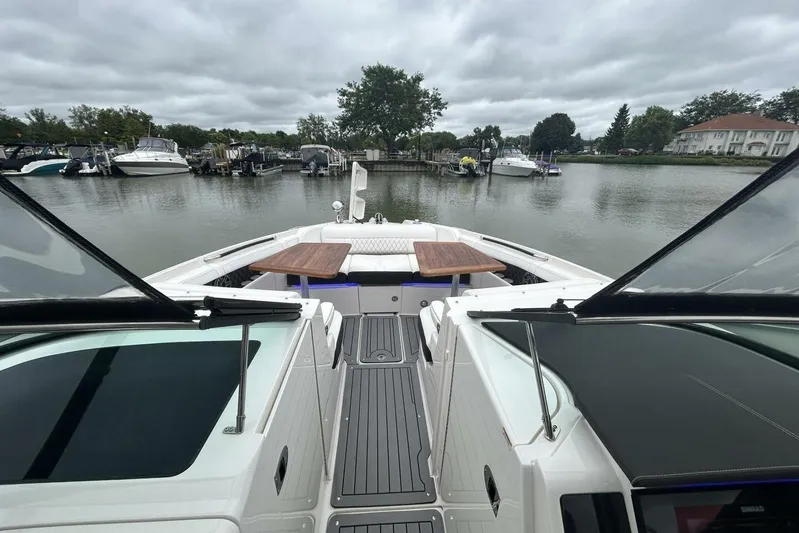  Yacht Photos Pics 2020 Sea Ray 350 SLX boat docked in a serene marina setting.