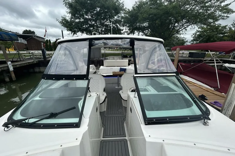  Yacht Photos Pics 2020 Sea Ray 350 SLX boat docked, featuring sleek design and spacious seating.