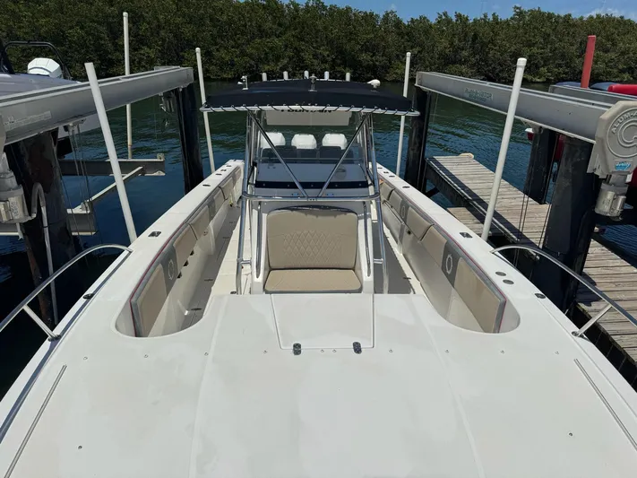  Yacht Photos Pics 2008 Fountain 38 TE boat docked, featuring spacious deck and seating area.