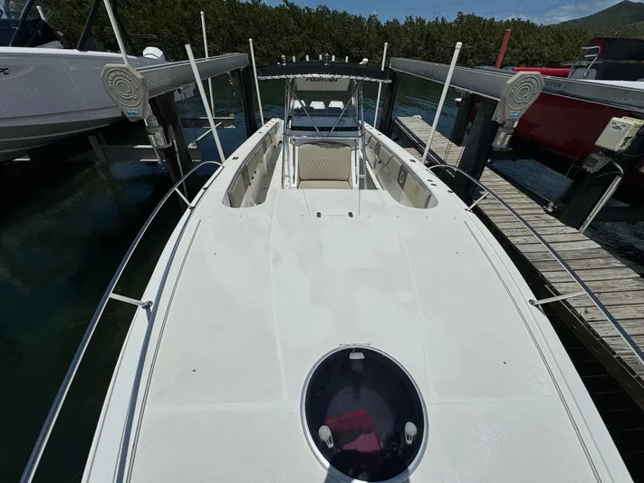  Yacht Photos Pics 2008 Fountain 38 TE boat docked, top view showing spacious deck and seating area.