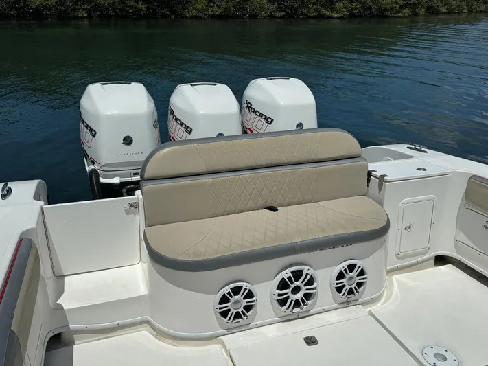  Yacht Photos Pics 2008 Fountain 38 TE boat with triple outboard engines and cushioned seating.