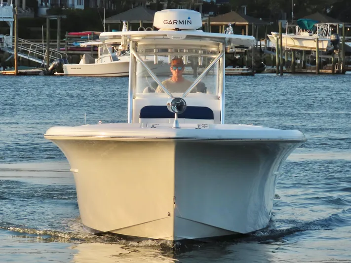  Yacht Photos Pics 2013 Buddy Davis 34 Center Console boat on water, front view, with Garmin equipment.