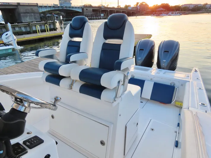  Yacht Photos Pics 2013 Buddy Davis 34 Center Console boat with dual seats and twin engines at sunset.