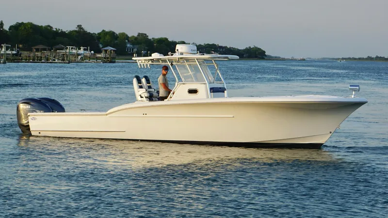 Yacht Photos Pics 2013 Buddy Davis 34 Center Console boat on calm water.