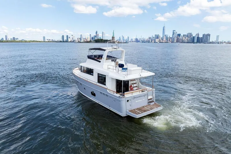 Dreamscape Yacht Photos Pics 2020 Beneteau Swift Trawler 50 cruising near city skyline and Statue of Liberty.